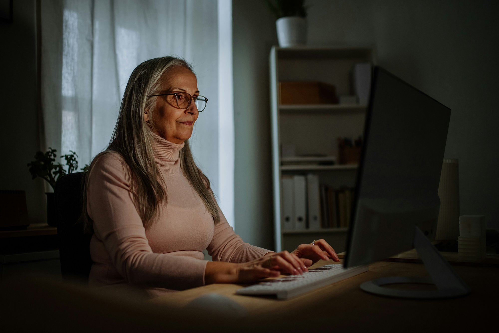 hire a genealogist woman working at computer